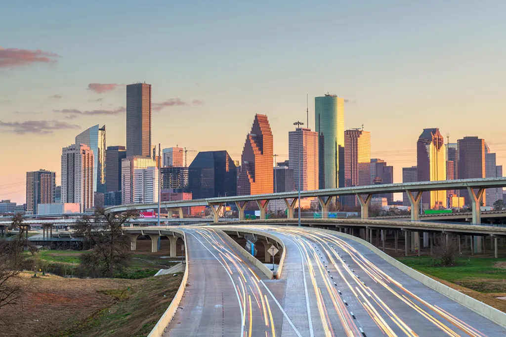 Houston, Texas, USA downtown skyline over the highways at dusk.