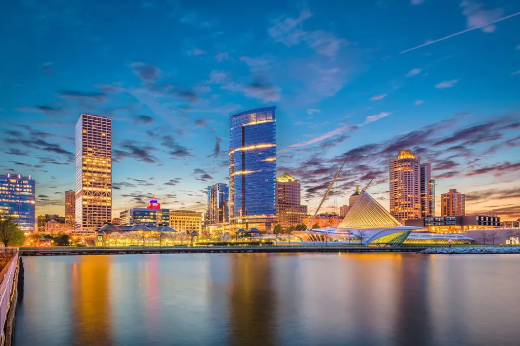 Milwaukee, Wisconsin, USA downtown city skyline on Lake Michigan at twilight.