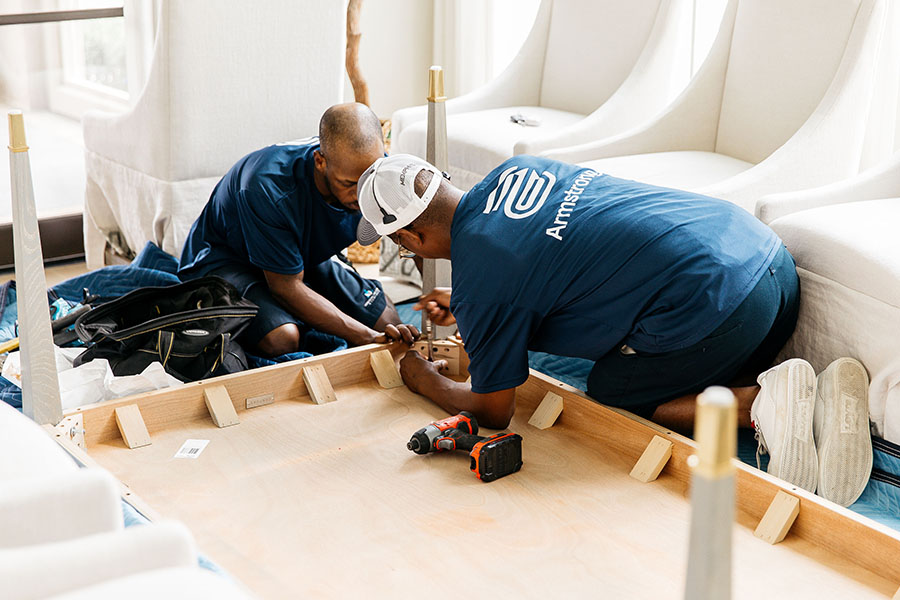 Armstrong staff assembling furniture