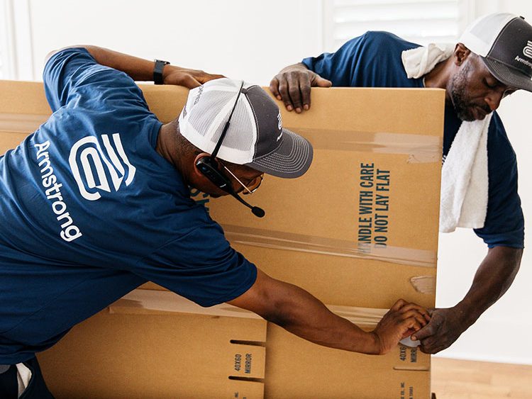 Movers packing big boxes
