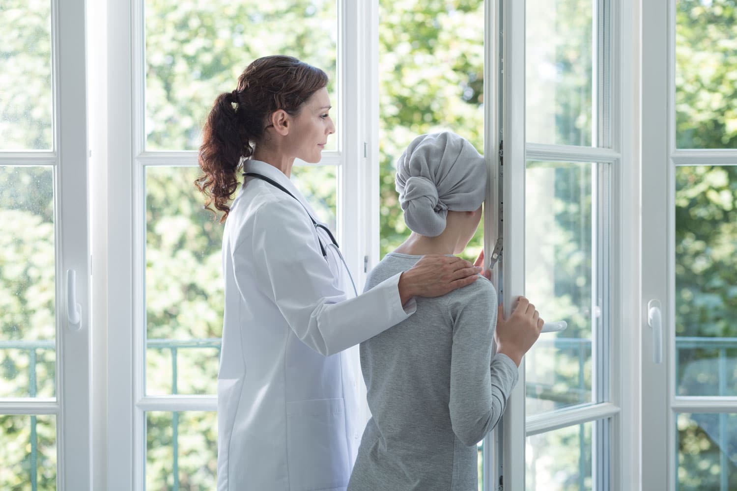 doctor helping cancer patient