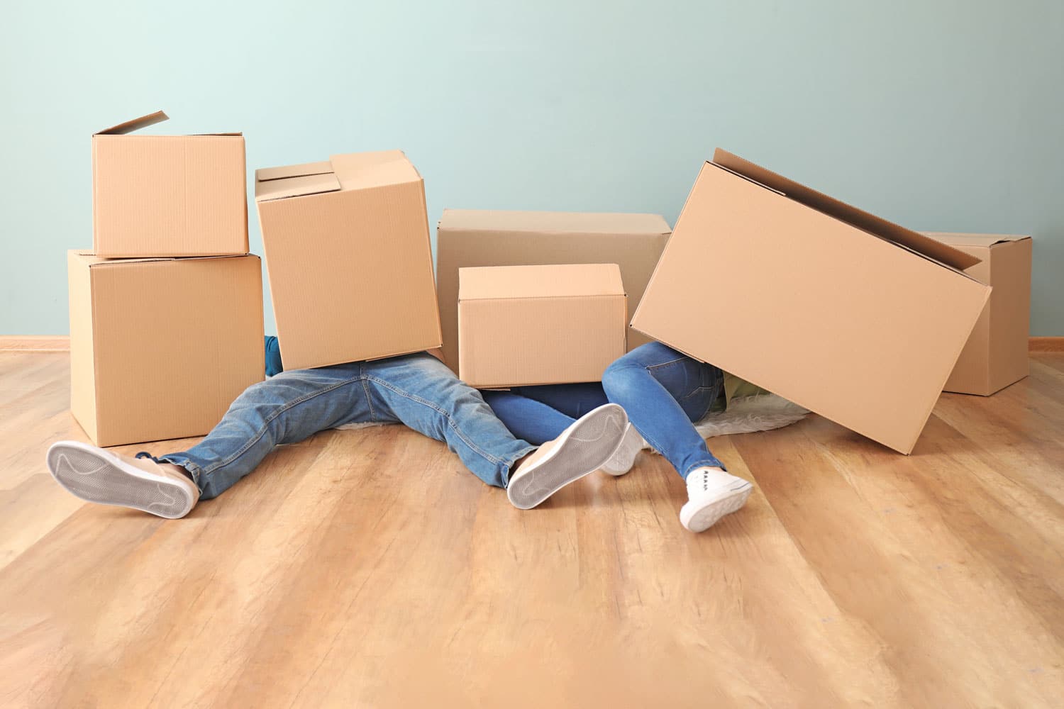 movers on floor with boxes on them