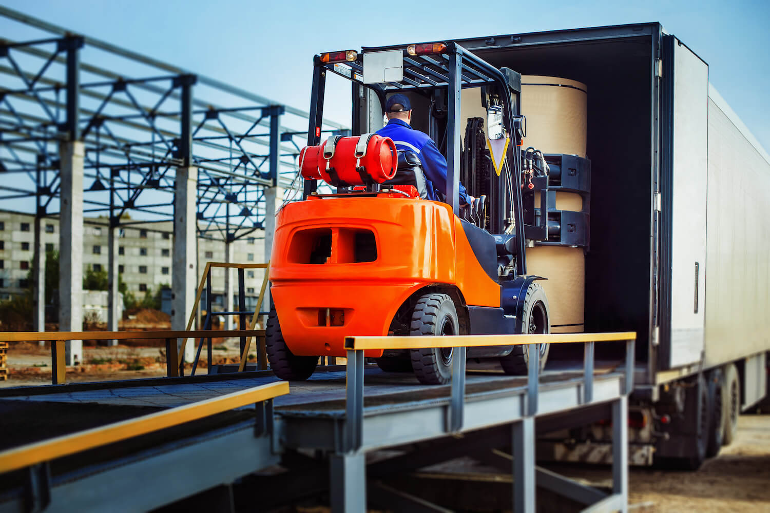 heavy equipment loading into truck